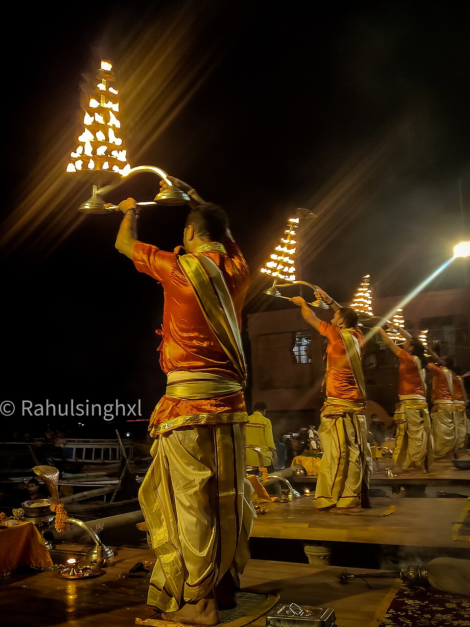 Evening river aarti with fire lamps (illustrative, Varanasi)